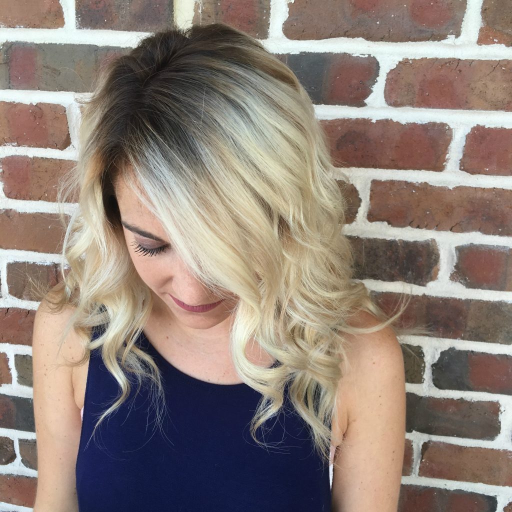 Looking for the perfect hairstyle to transition from summer to fall? Shadow roots are the perfect way to add some darker color to your blonde and give you perfect fall locks. 