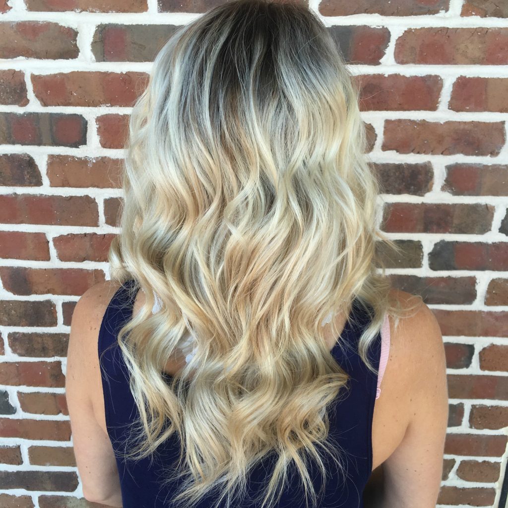 Looking for the perfect hairstyle to transition from summer to fall? Shadow roots are the perfect way to add some darker color to your blonde and give you perfect fall locks. 