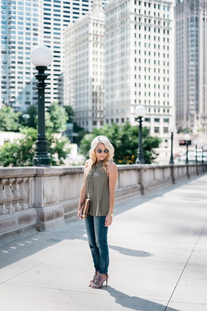 When transitioning from summer to fall with jeans it's important to mix different pieces that can balance each other. Mixing jeans with sleeveless tops and open toed shoes help keep your fall look light and airy.  Click through to see more tips! 