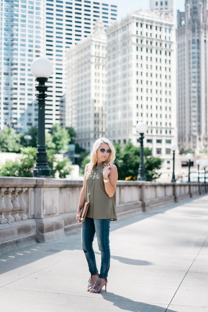 When transitioning from summer to fall with jeans it's important to mix different pieces that can balance each other. Mixing jeans with sleeveless tops and open toed shoes help keep your fall look light and airy.  Click through to see more tips! 