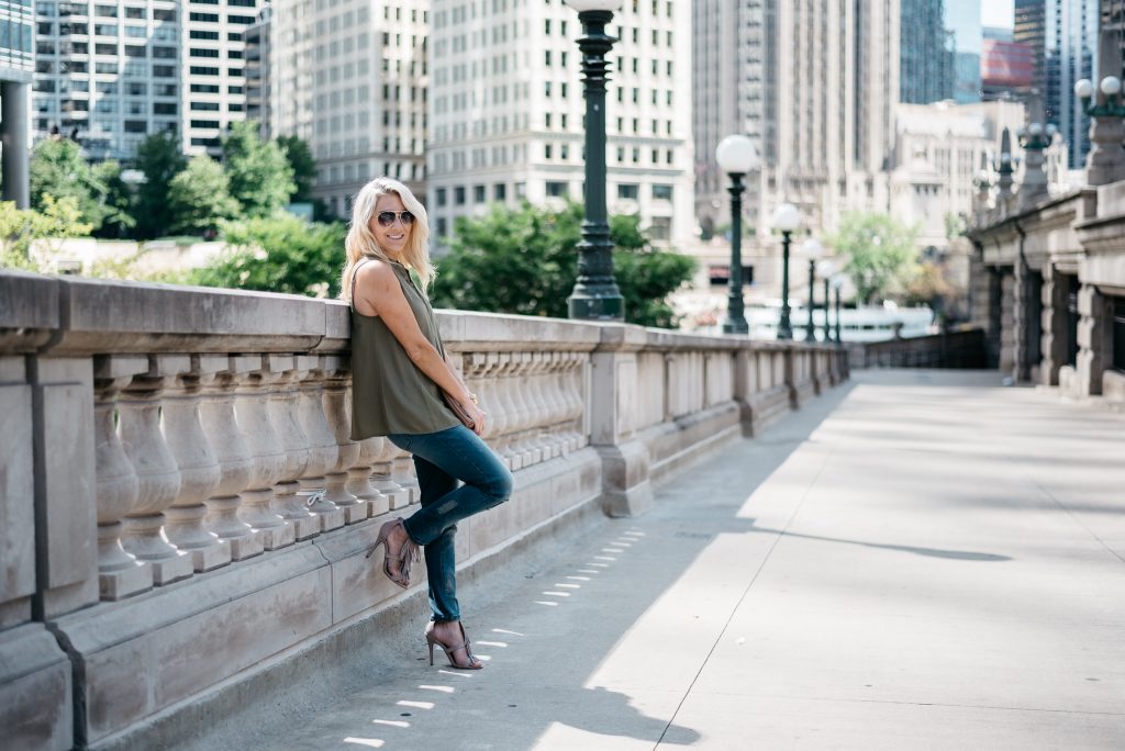 When transitioning from summer to fall with jeans it's important to mix different pieces that can balance each other. Mixing jeans with sleeveless tops and open toed shoes help keep your fall look light and airy.  Click through to see more tips! 