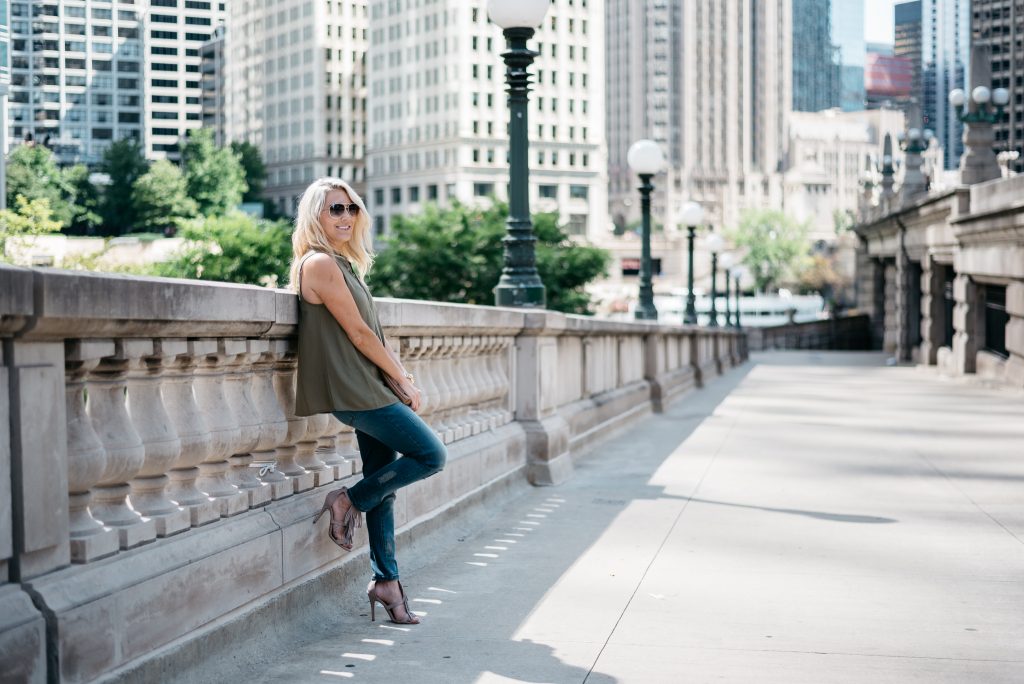 When transitioning from summer to fall with jeans it's important to mix different pieces that can balance each other. Mixing jeans with sleeveless tops and open toed shoes help keep your fall look light and airy.  Click through to see more tips! 