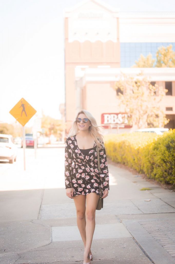 Black floral romper from Mo and Cho Boutique; pair with a pair of pumps for the perfect nighttime look. 