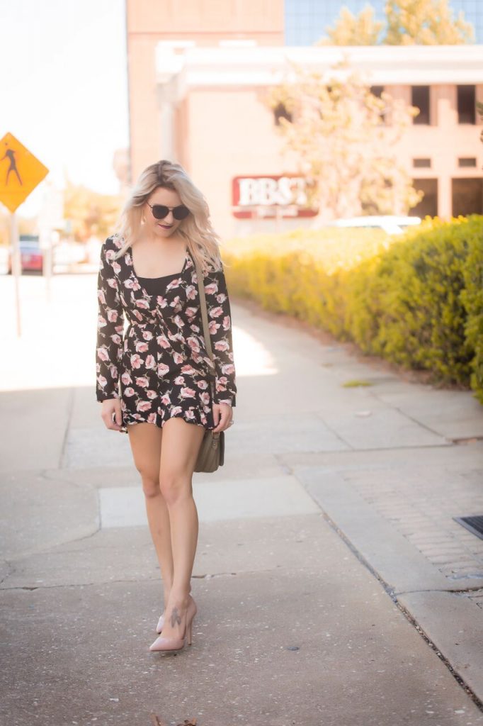 Black floral romper from Mo and Cho Boutique; pair with a pair of pumps for the perfect nighttime look. 