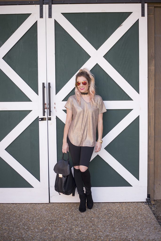 New Years Eve Looks: Casual featuring a sparkly gold top, black cutout leggings and black booties. Minimum jewelry with a black lace choker and gold watch. 