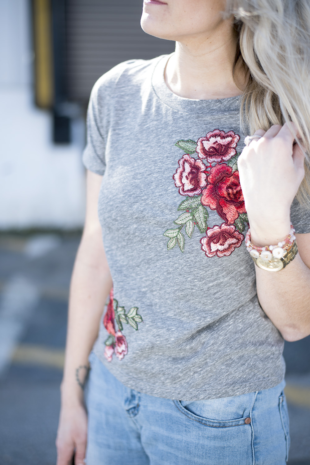 Embroidered roses tee paired with jeans and tennis for a comfortable but chic daytime look. 