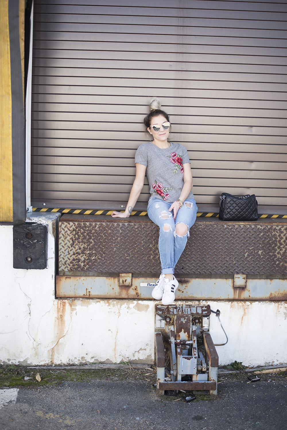 Embroidered roses tee paired with jeans and tennis for a comfortable but chic daytime look. 