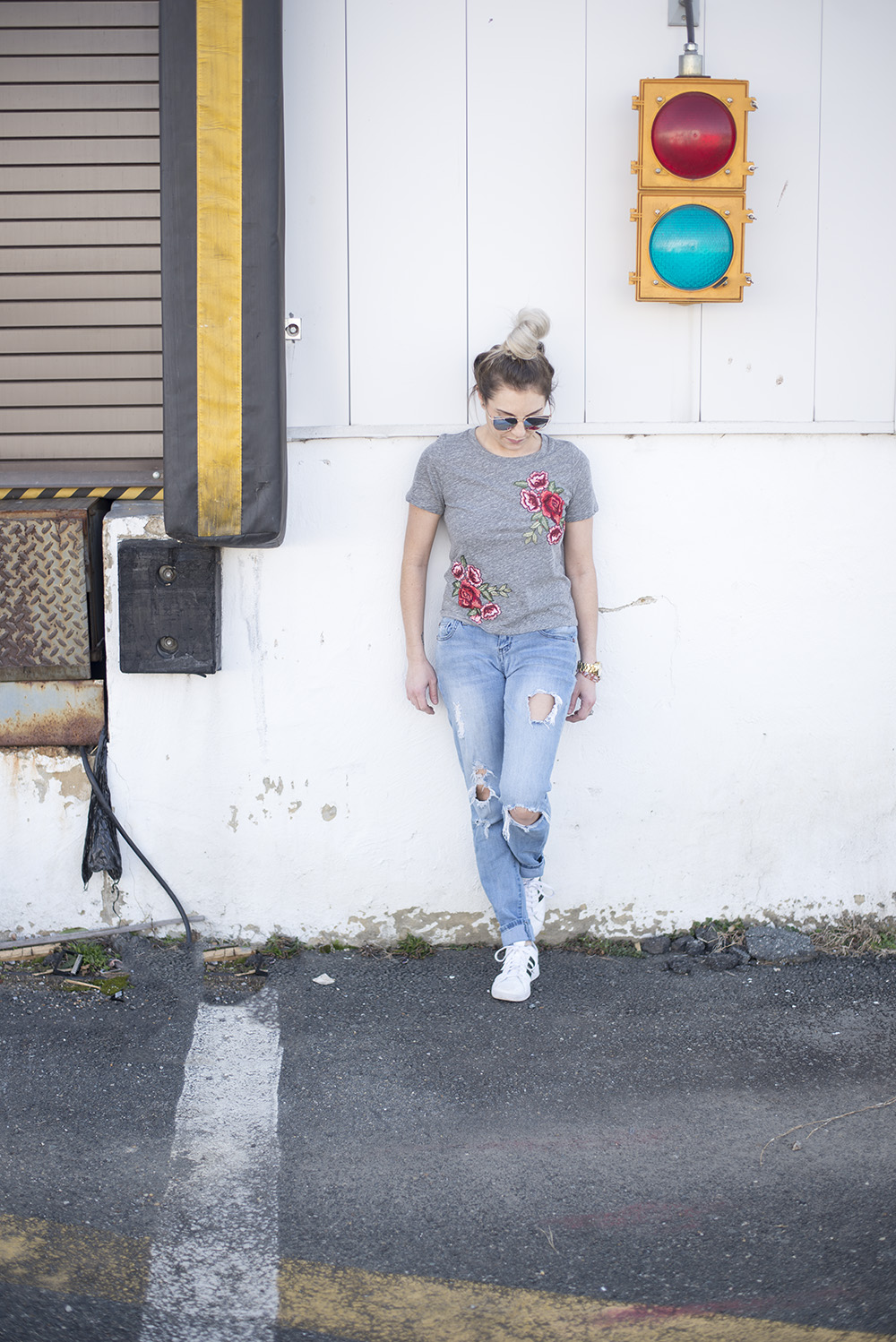 Embroidered roses tee paired with jeans and tennis for a comfortable but chic daytime look. 