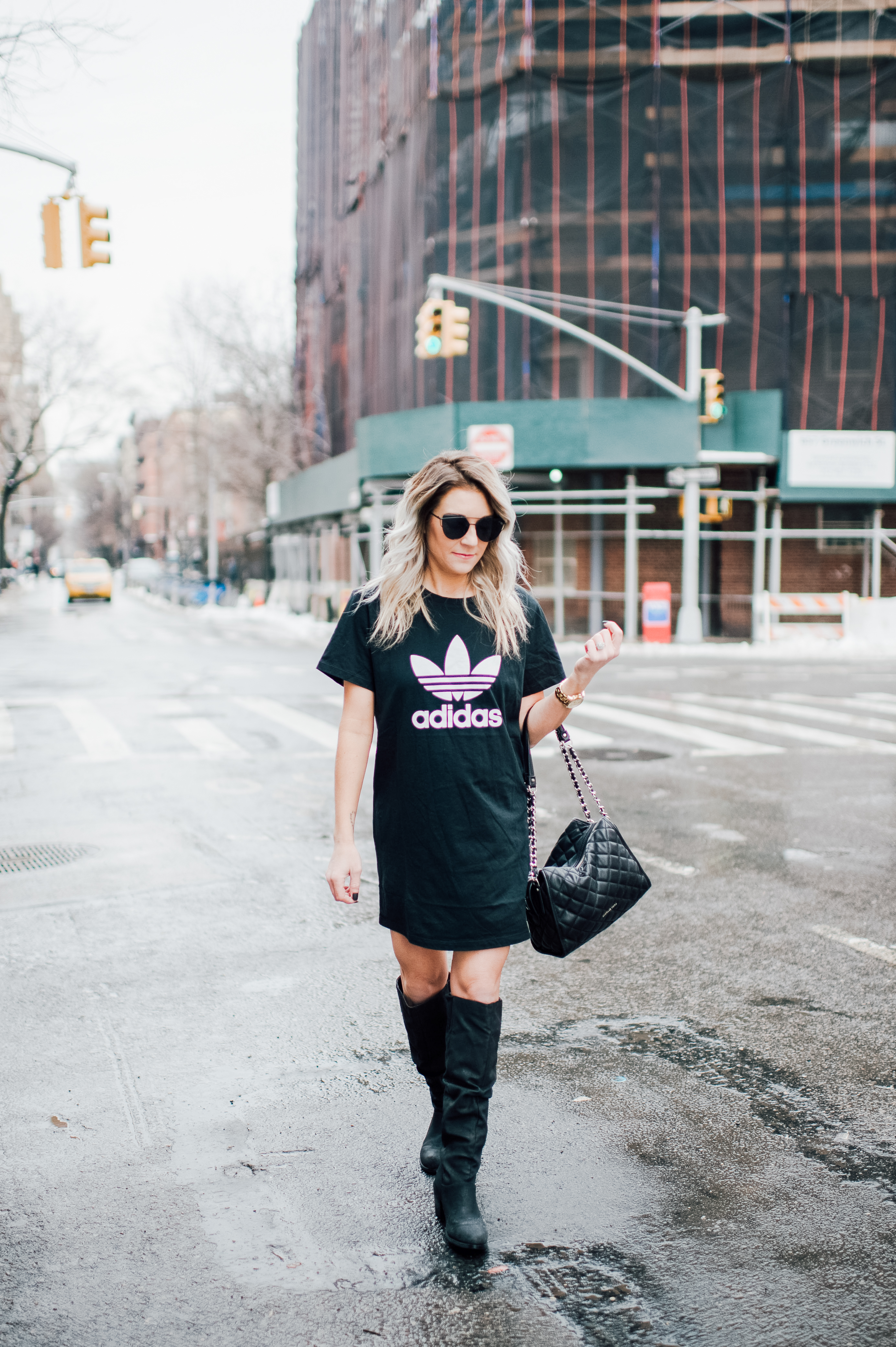 Adidas T-Shirt dress with high boots. Click through for more on how to wear a t-shirt dress. 