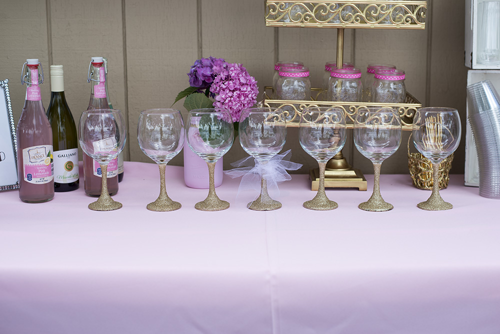 How to throw the perfect pink and gold bridal shower. Everything from DIY Glitter Wine glasses to a wine bar! 