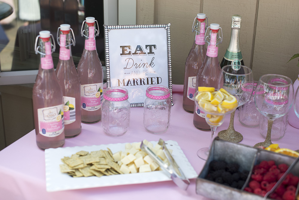 How to throw the perfect pink and gold bridal shower. Everything from DIY Glitter Wine glasses to a wine bar! 