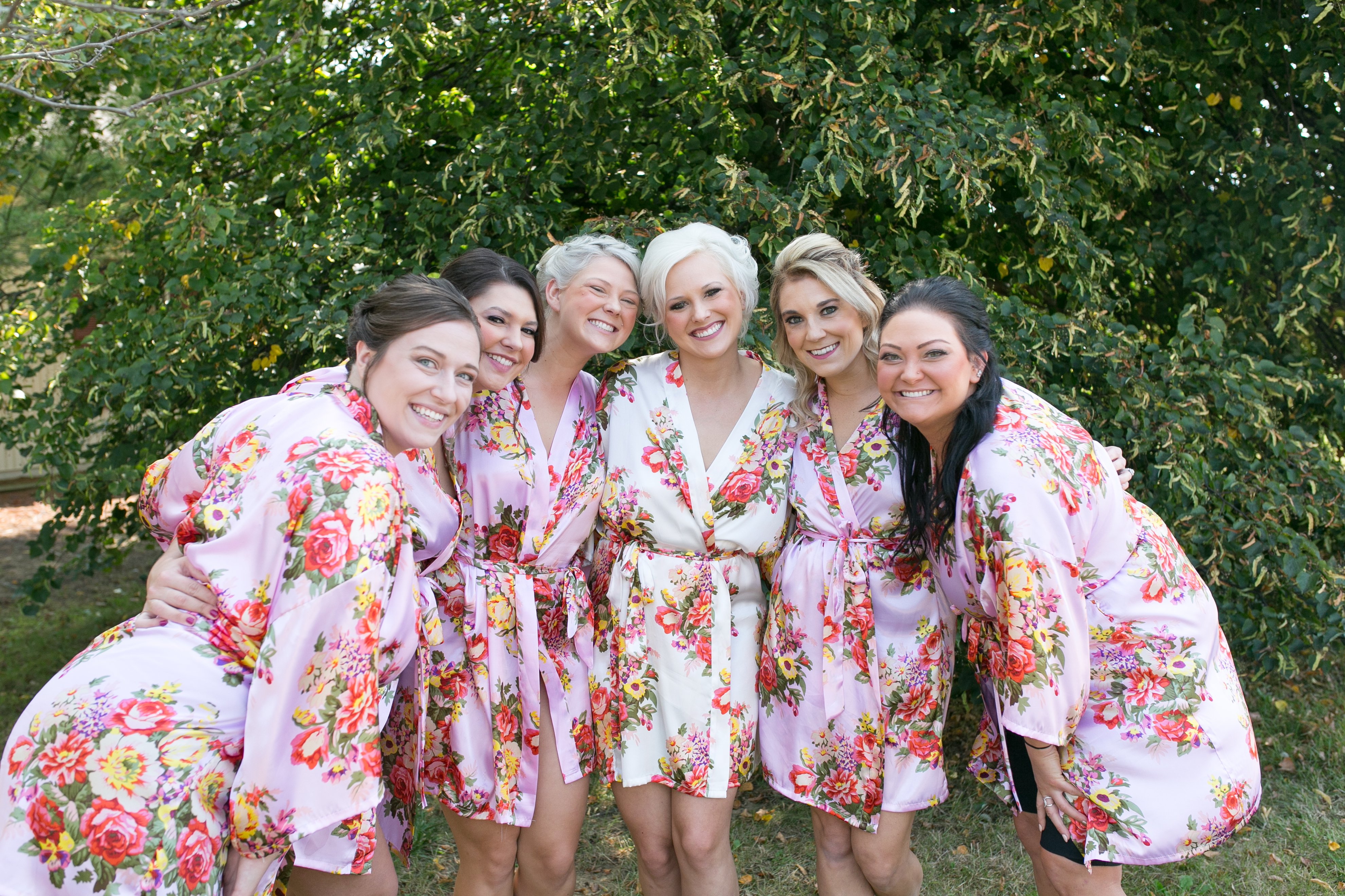 A perfect fall wedding; bridesmaids getting ready for the day in matching robes. 