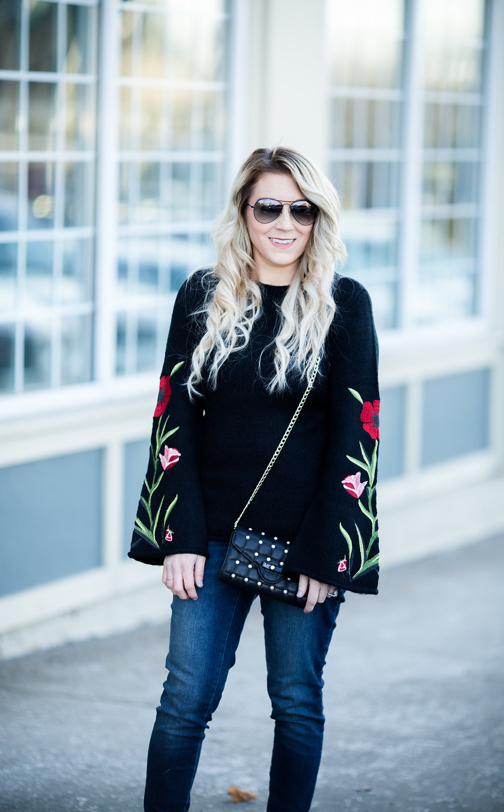 An embroidered floral sweater is the perfect way to transition your wardrobe from winter to fall! 