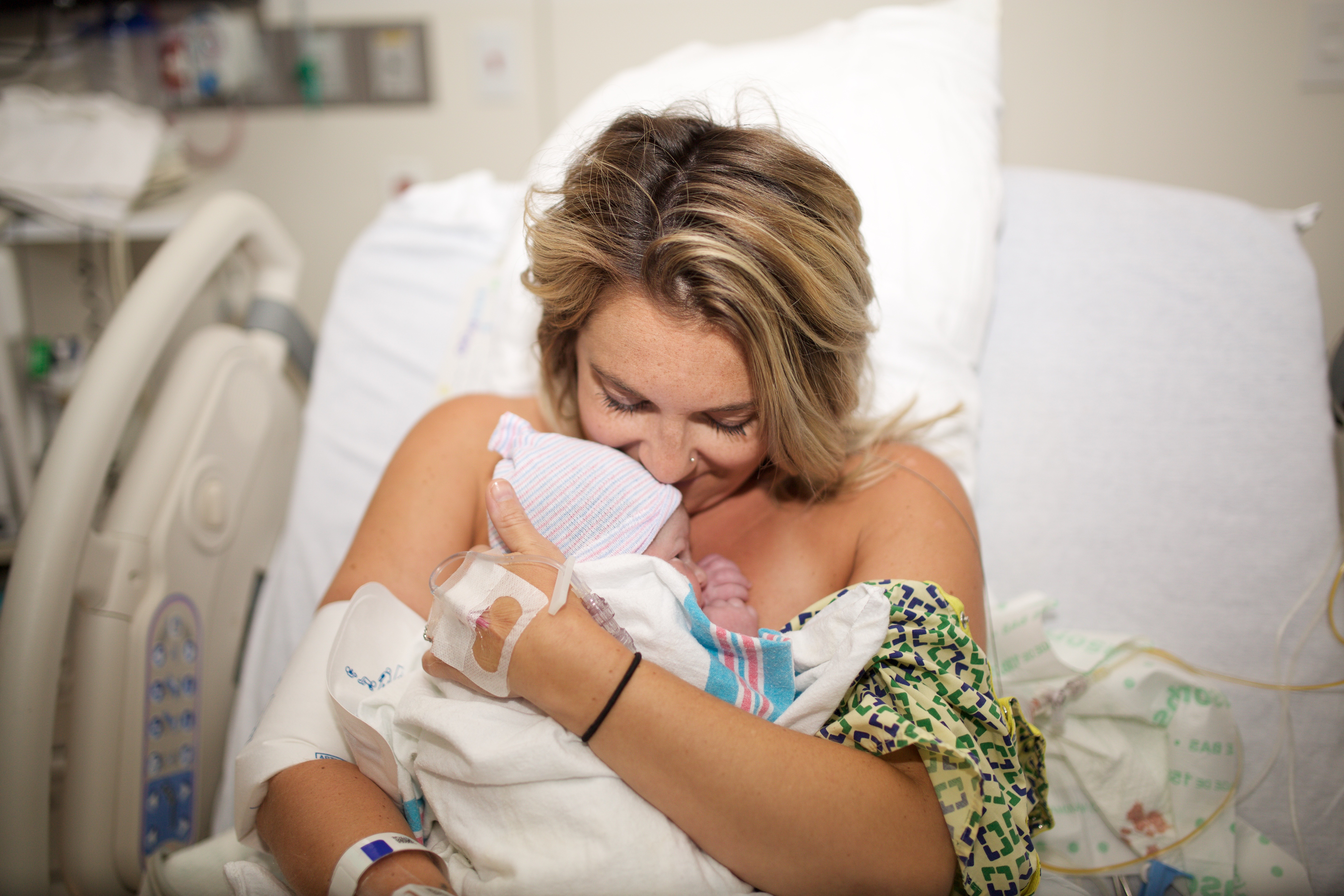 Cleveland blogger The Samantha Show shares her daughter's birth story featuring birth photography from Cleveland newborn photographer State of the Heart Photography. 